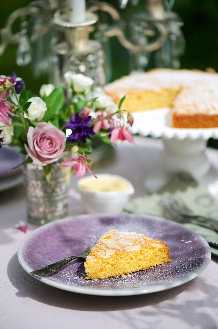 A slice of almond cake and crème anglaise with honey mustard