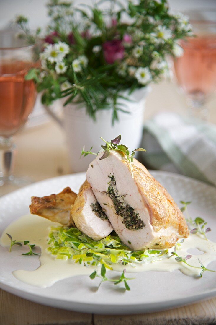 Thyme-stuffed chicken breast on a bed of creamy leek