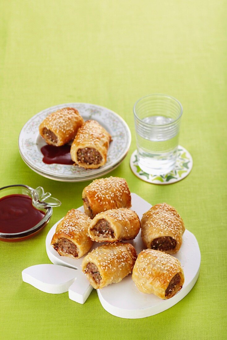 Puff pastry rolls with sausage meat and apple filling