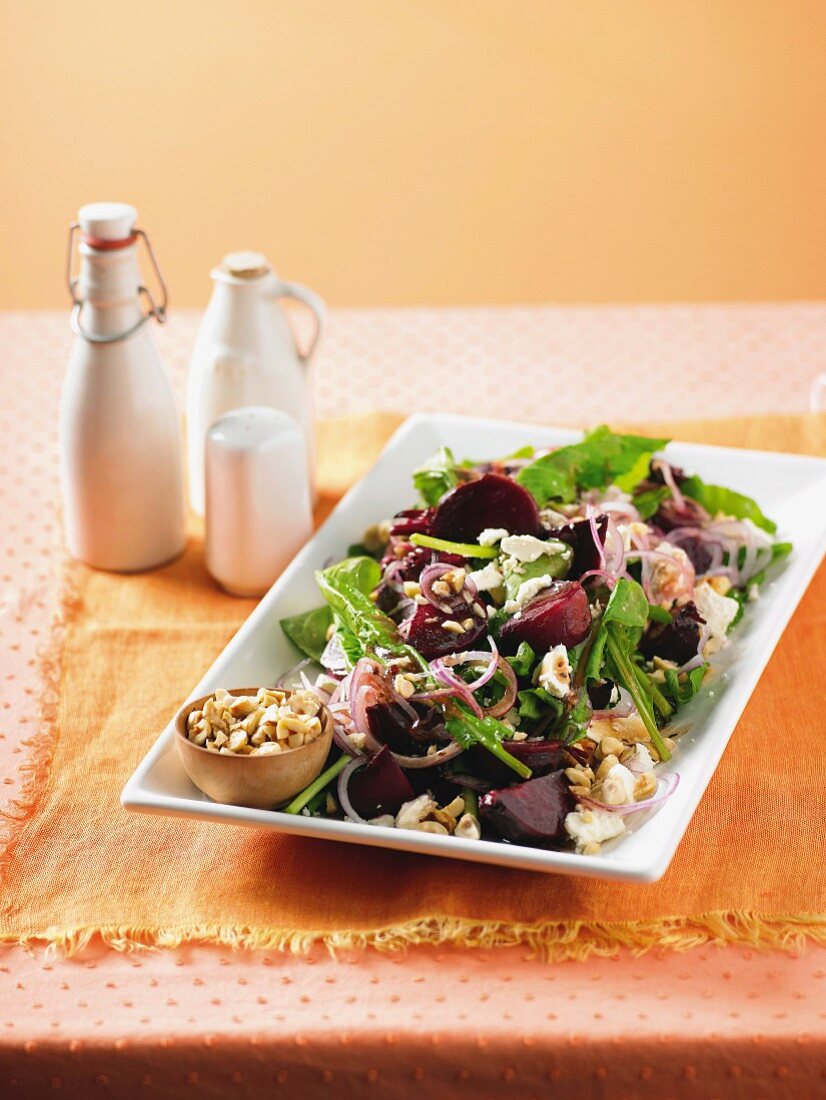 Salad with caramelised beetroot, feta, nuts and rocket salad