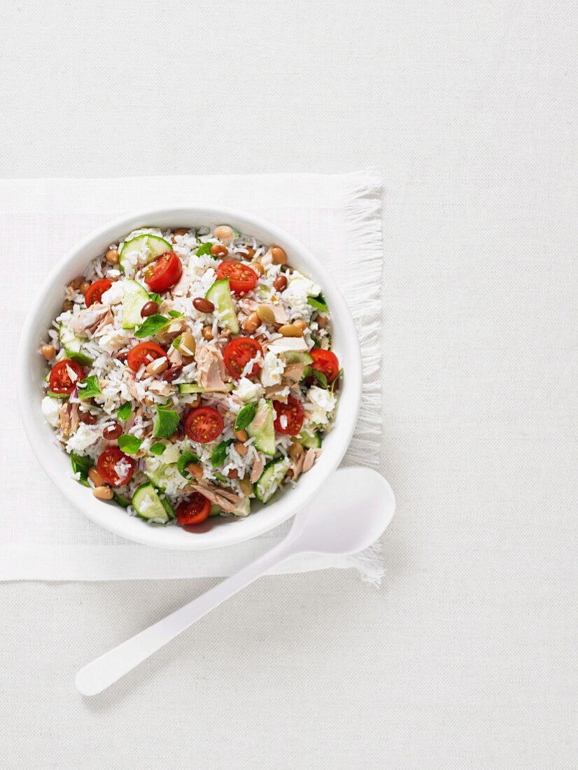 Mixed rice salad with tuna, beans and tomatoes (top view)
