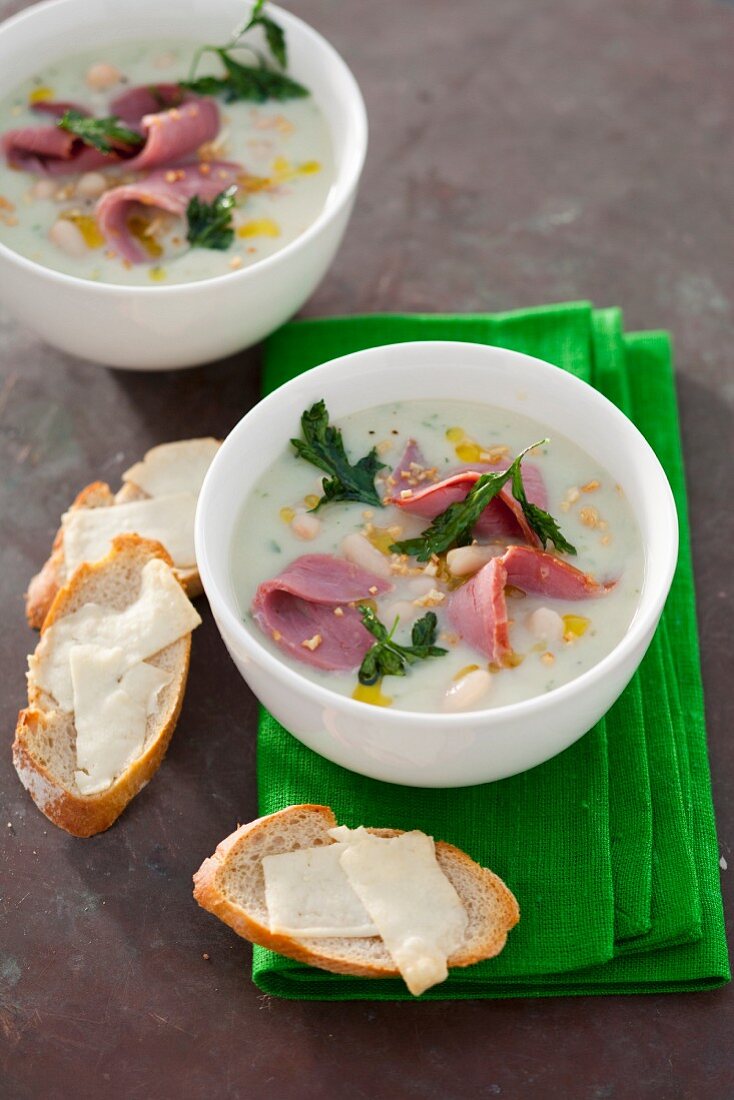 White bean soup with smoked duck breast and parsley