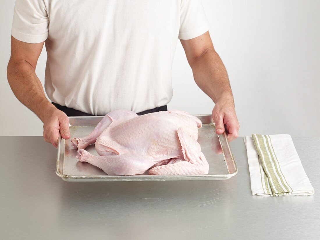 A fresh turkey on a baking tray
