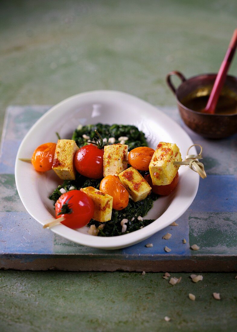 Tomato and tofu skewers with spinach