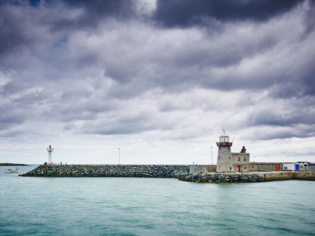 The harbour wall and light tower in Howth (Dublin, Ireland)