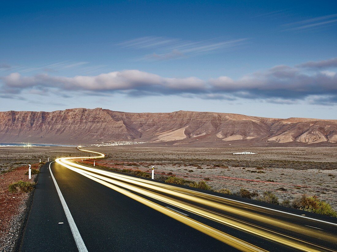 Light tracks on the road to Famara on Lanzarote (Spain)