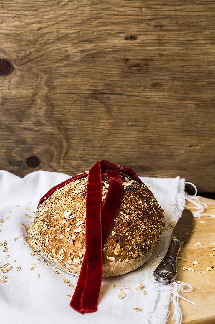 Wholemeal bread with a red velvet ribbon