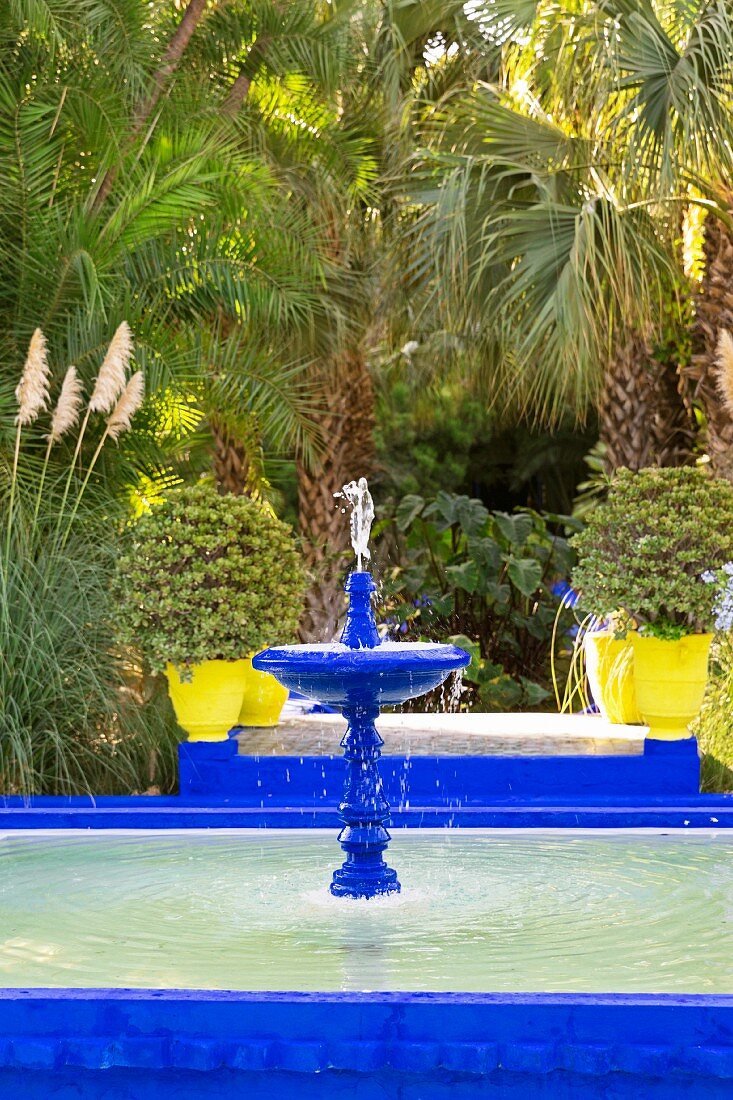 A fountain in the Jardin Majorelle in Marrakesh in the garden created by the French artist Jacques Majorelle in 1923 using his trademark shade of blue