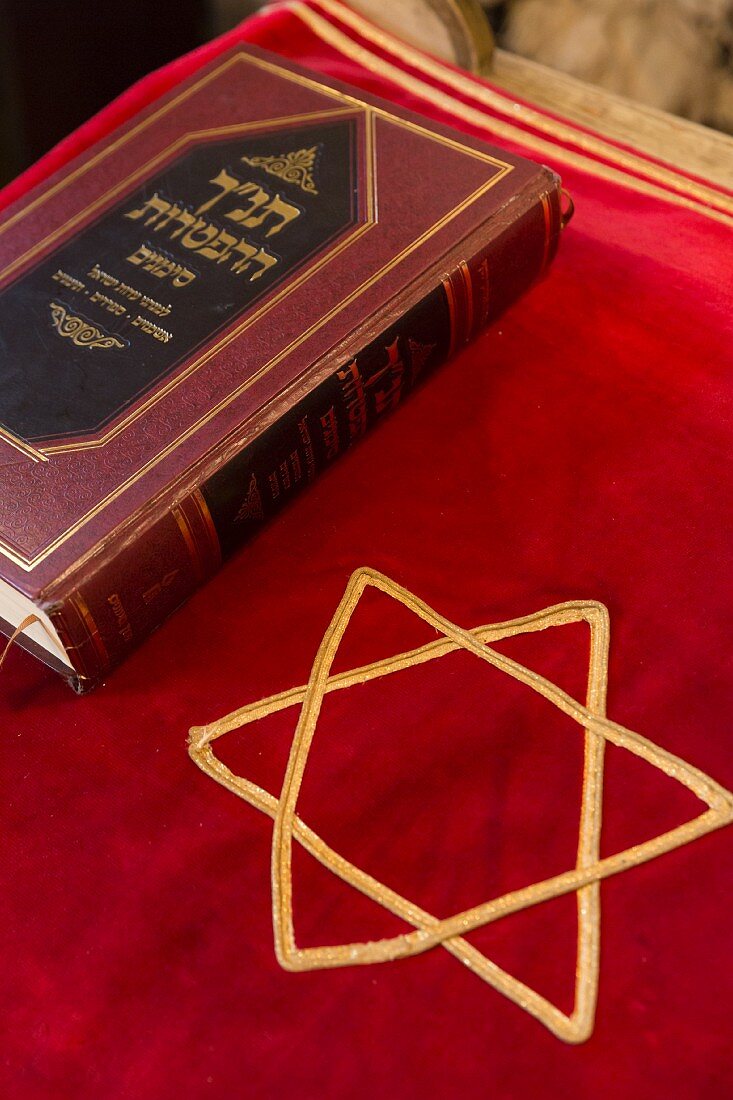 Symbols of the Jewish religion: a bima cloth, Star of David and the Tora