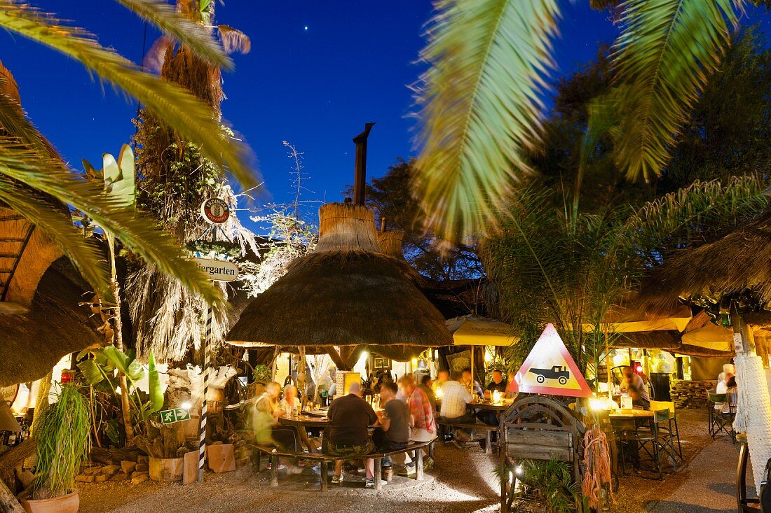 Drinks under palm trees at Joe's Beerhouse, Windhoek, Namibia, Africa