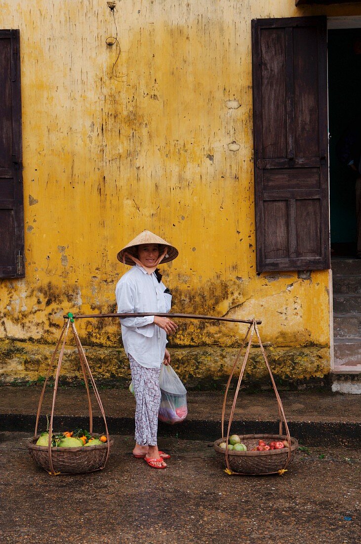 A fruit seller in Hoi An, Vietnam, Indochina, South-East Asia