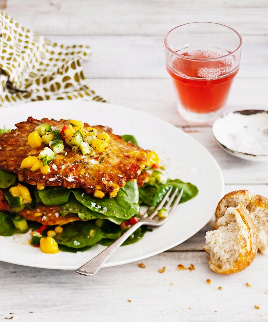Corn fritters with mango salsa and rocket