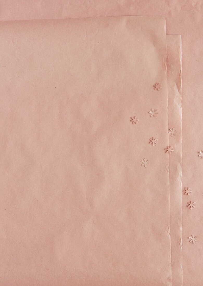 A background of pink paper with stars