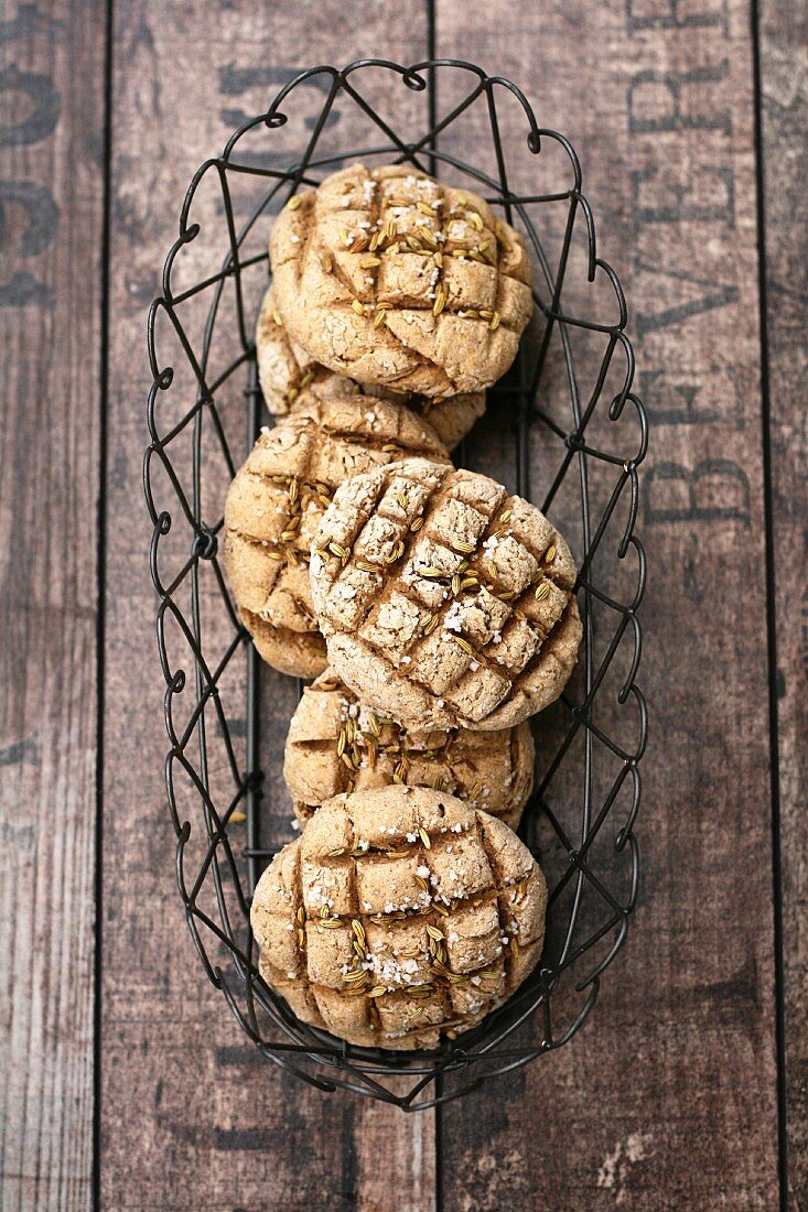 Rye bread rolls in a wire basket