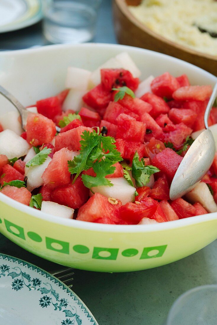 Tomato salad with watermelon, coriander and chilli peppers
