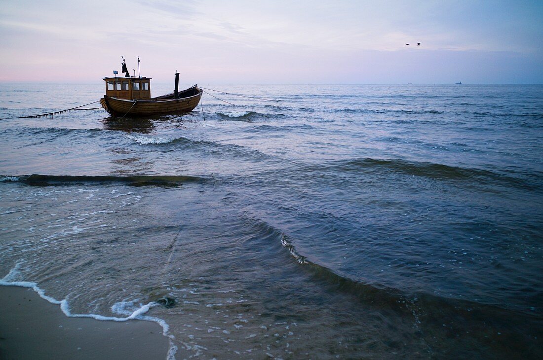 A fishing boat at dusk on the Baltic Sea near Ahlbeck, Mecklenburg-Vorpommern