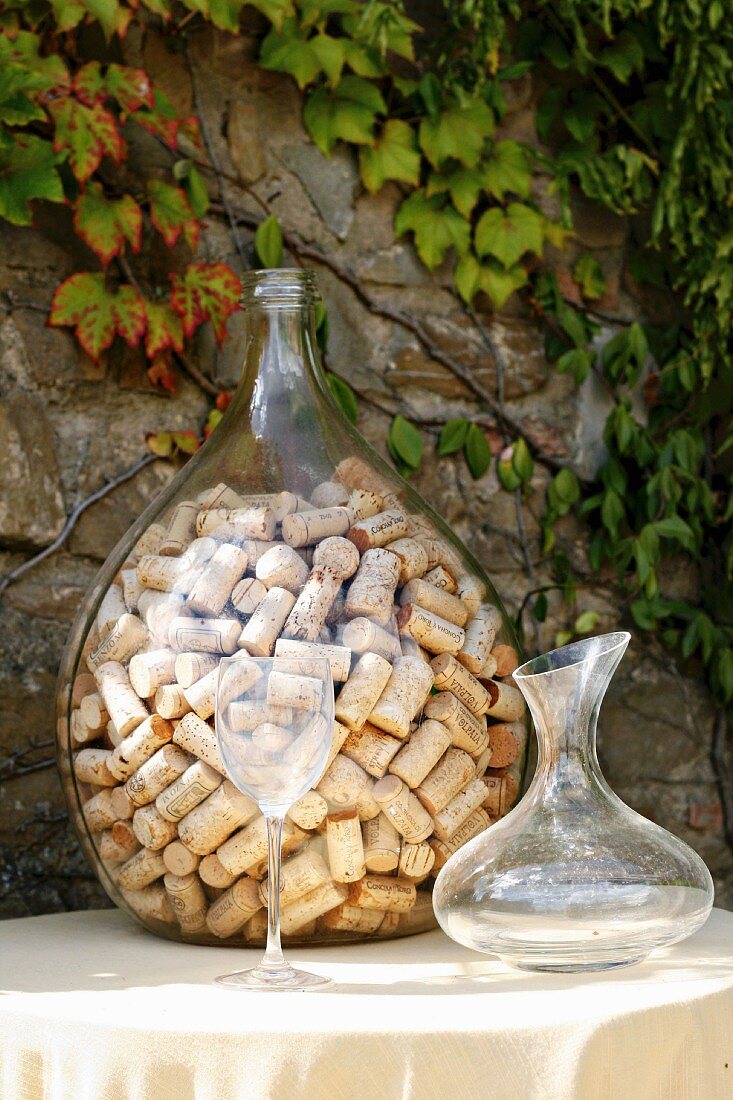 Collection of wine bottle corks in demijohn