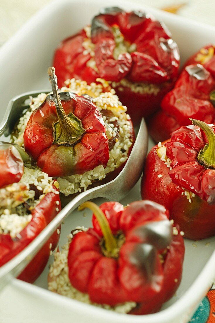 Peppers filled with rice and dates sprinkled with sesame seeds