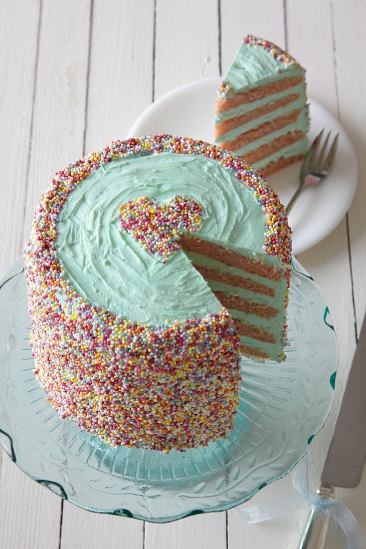A layer cake with colourful sugar sprinkles for Valentine's Day