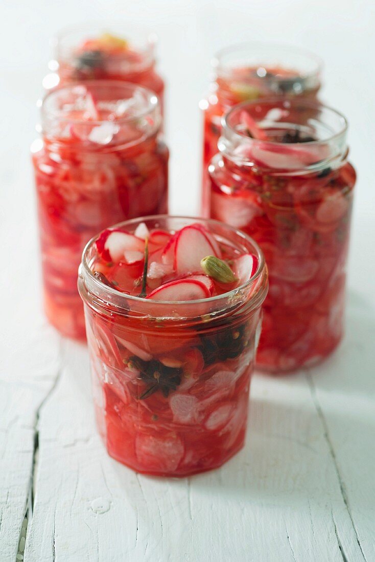 Pickled radishes in screw-top jars