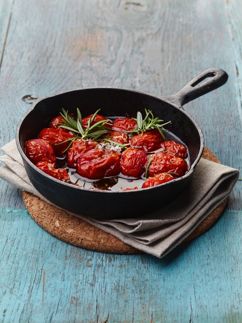 Tomatoes braised in olive oil with rosemary