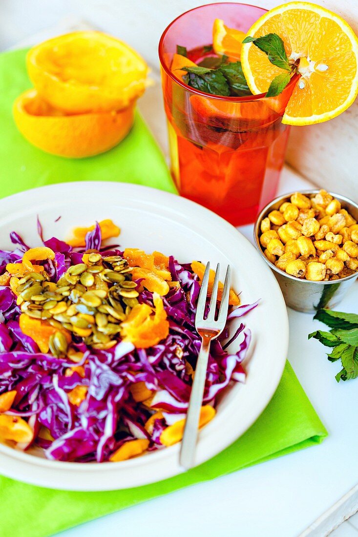 Red cabbage salad with oranges and pumpkin seeds