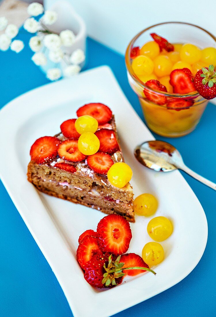 Gluten-free cake with strawberries and white cherries