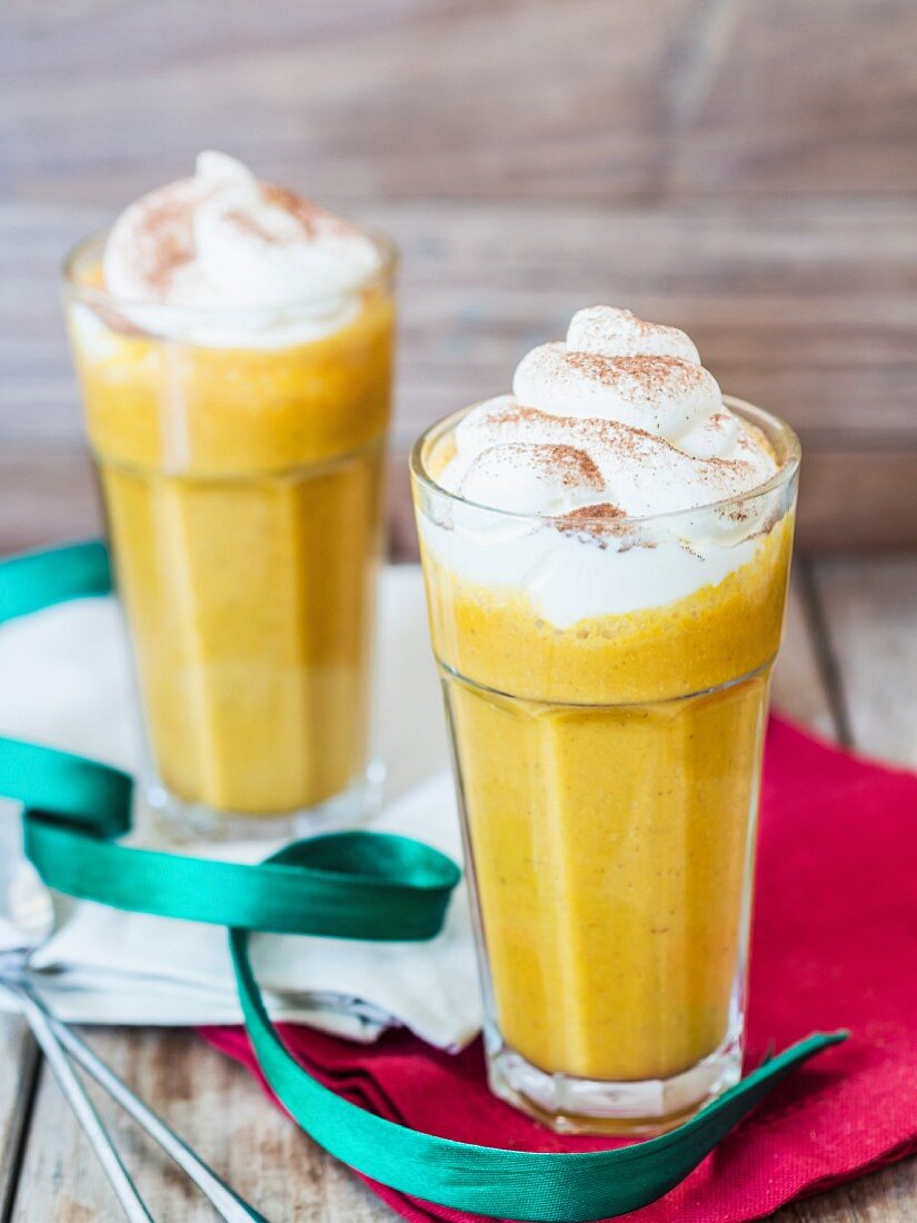 Pumpkin spice smoothies with whipped cream.