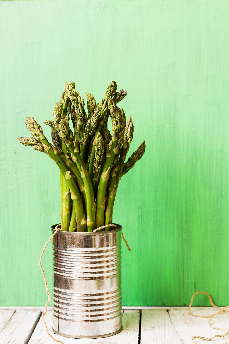 Green asparagus in a tin can