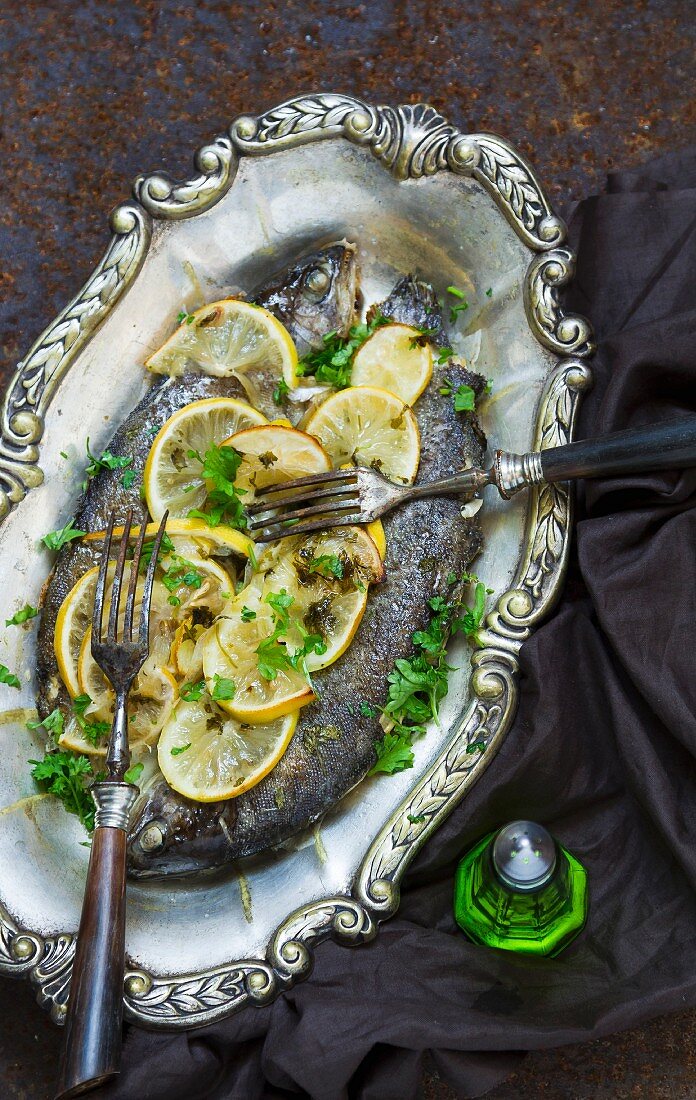 Fried trouts with lemons and parsley