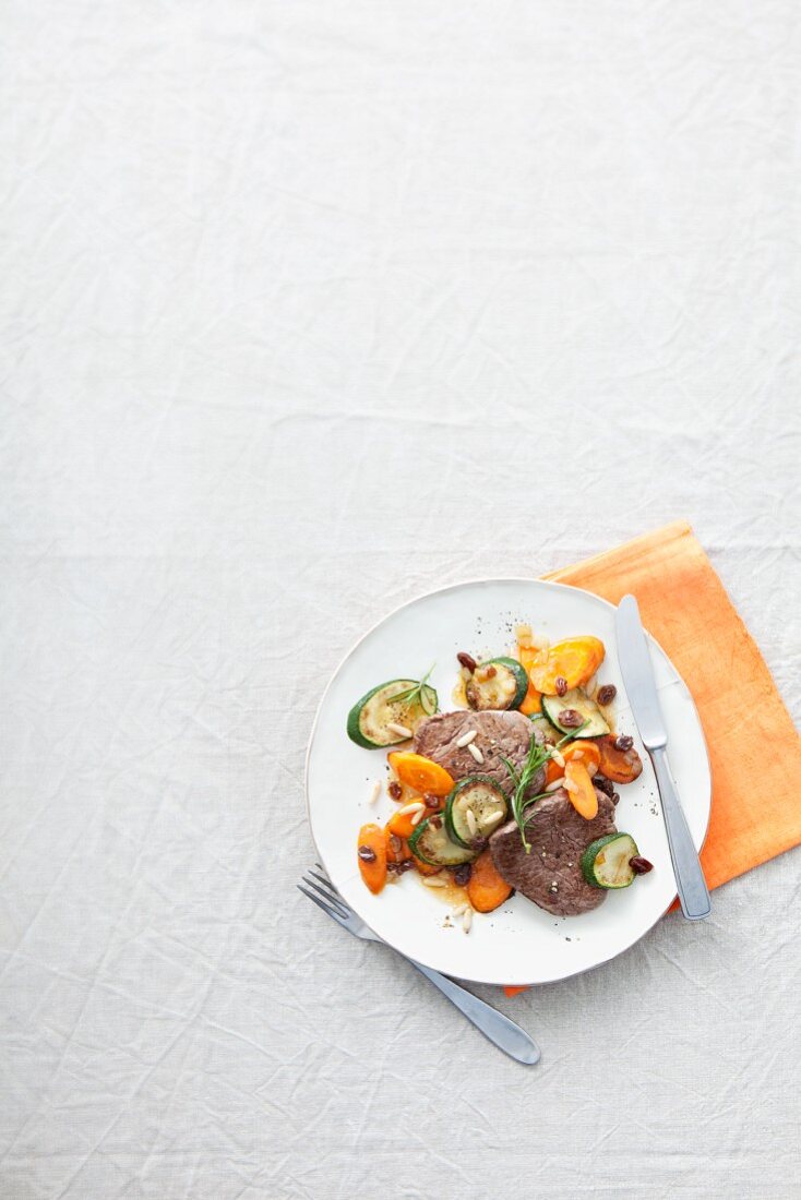 Fillet steak on a bed of courgettes and carrots