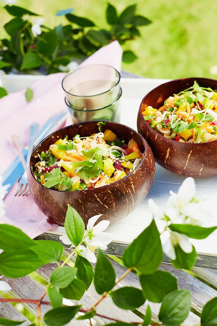 Thai salad made from pepper, mango, beetroot and bean sprouts with almonds