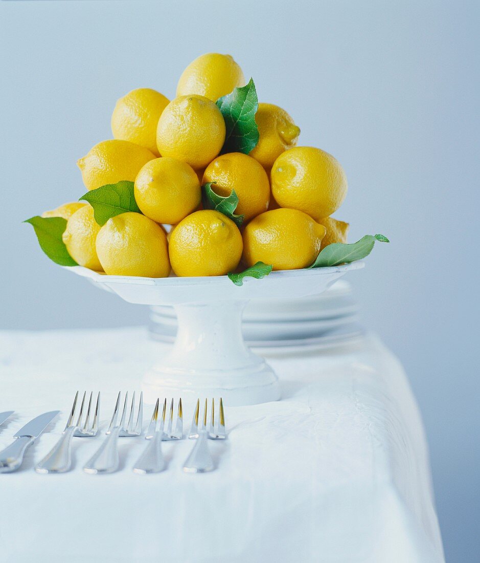 Lemons stacked on a cake stand