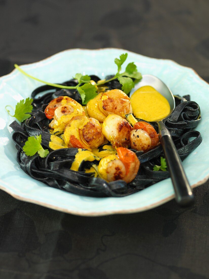 Squid pasta with scallops and saffron sauce
