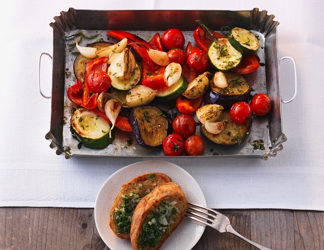 Oven-roasted Mediterranean vegetables with garlic and herb baguette