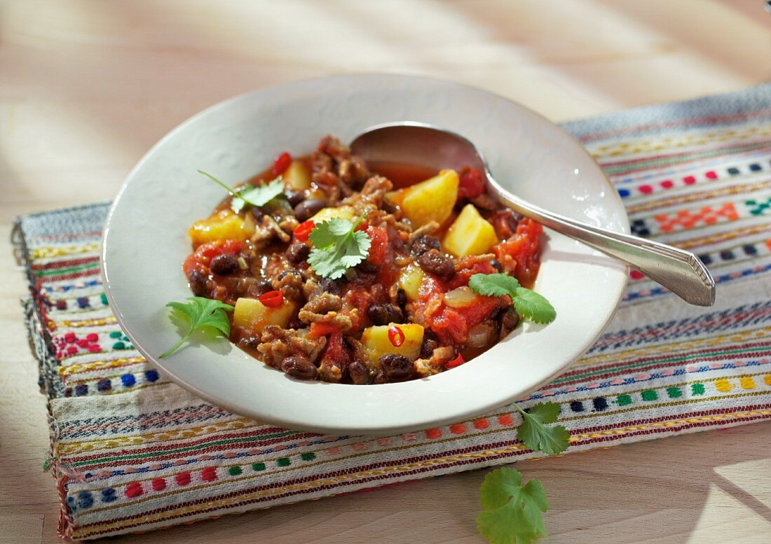 Black bean chilli with potatoes and coriander