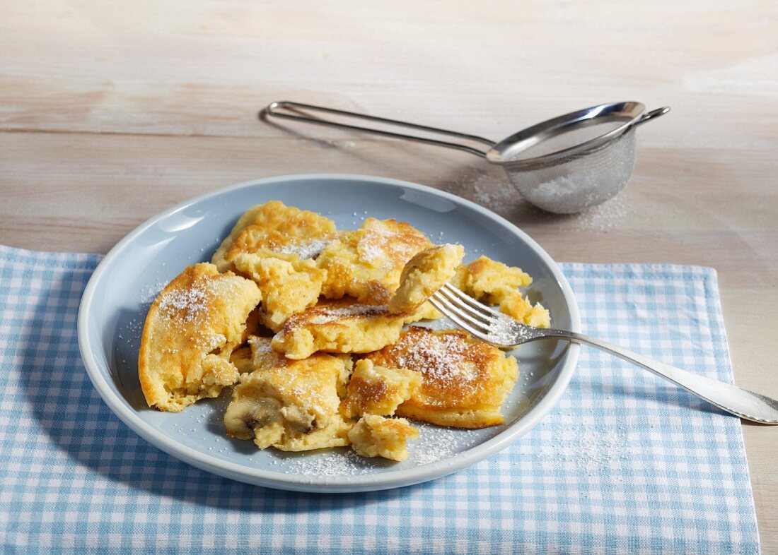 Shredded banana pancake with icing sugar