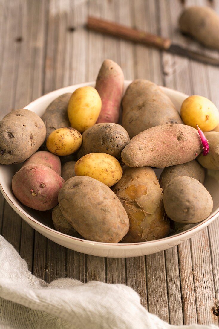 Various types of potatoes in a bowl