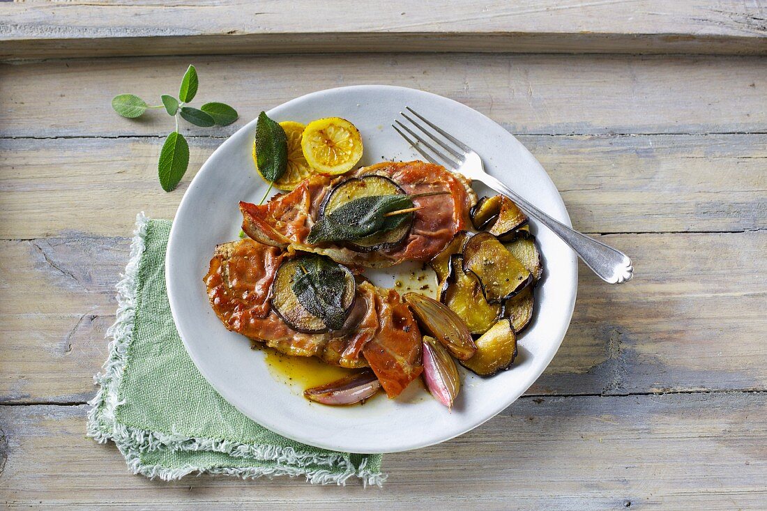 Saltimboca with an aubergine and shallot medley