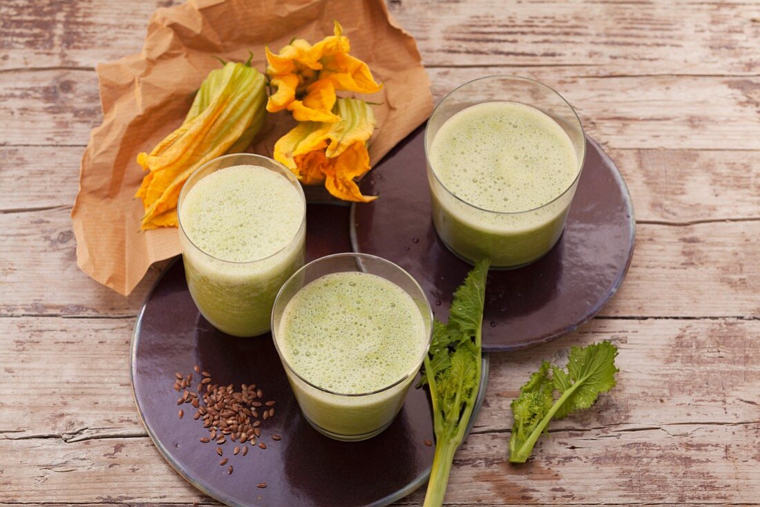 Durian smoothies made with courgette leaves, almonds, dates, kale and buttercups