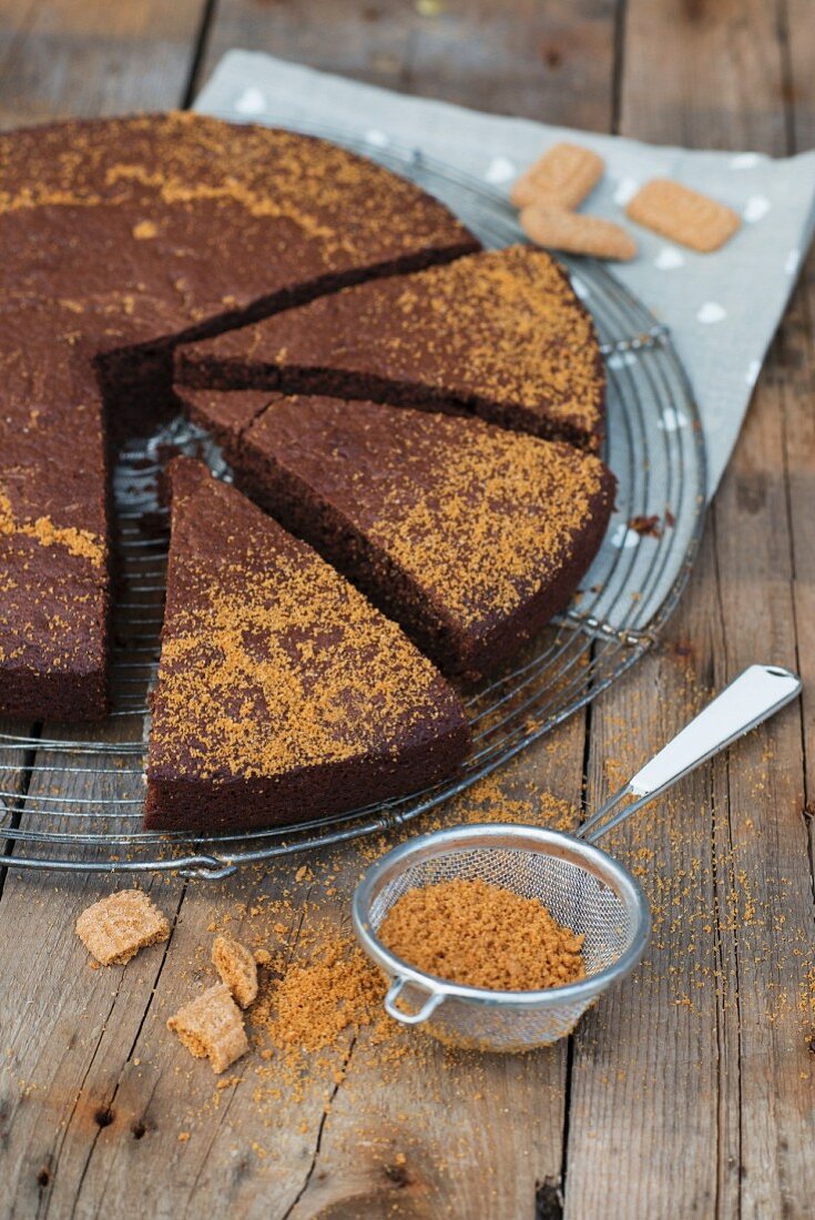 Chocolate cake with gingerbread on a wire rack