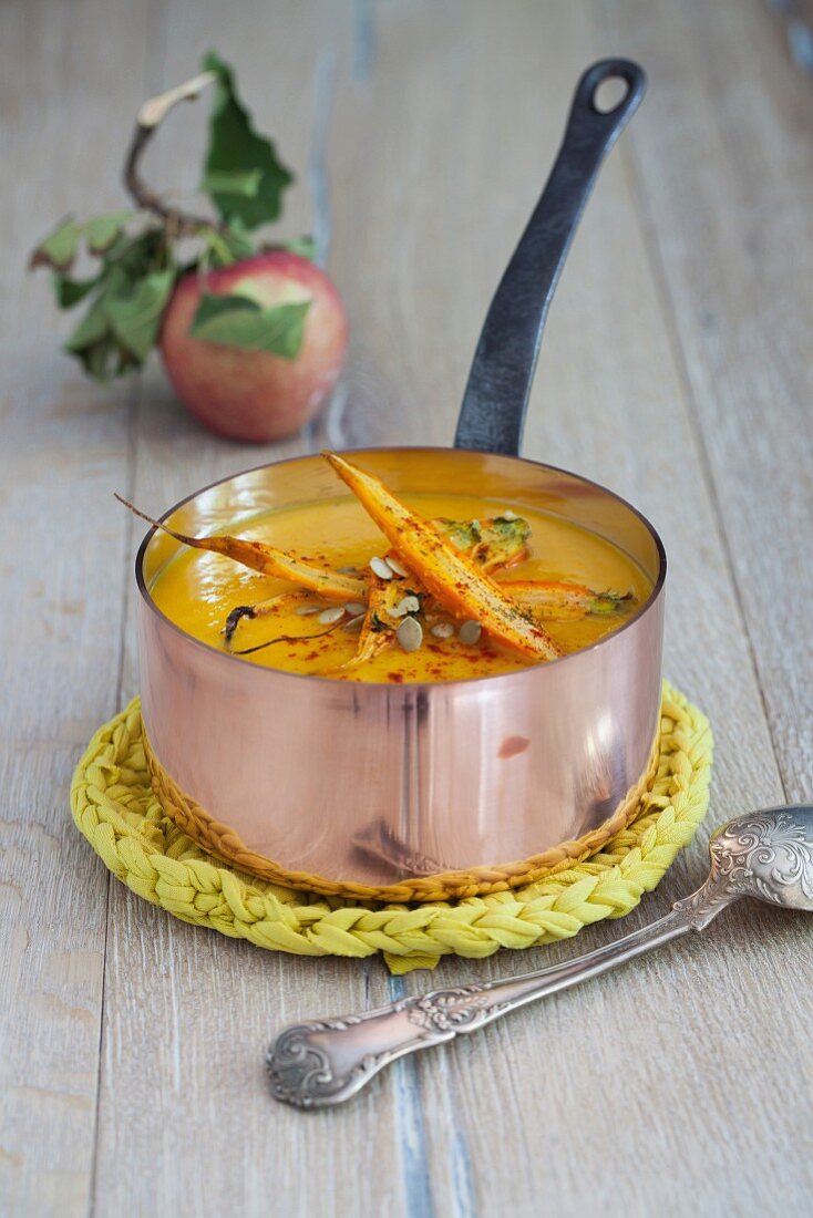 Pumpkin and apple soup with roasted carrots and pumpkin seeds