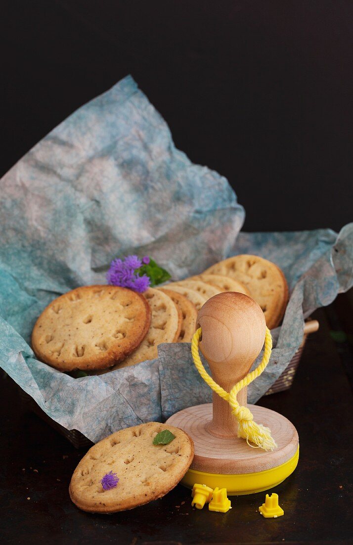 Stamped hazelnut biscuits and baking utensils