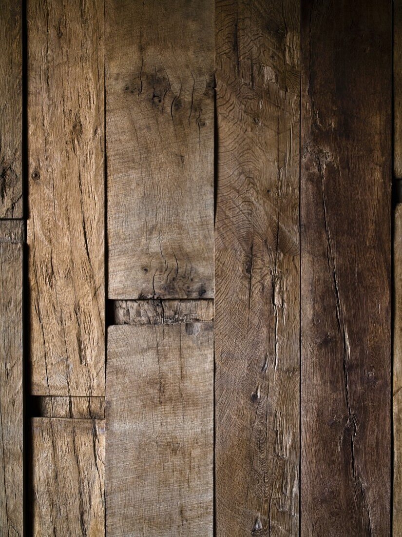 Wooden wall made from weathered, reclaimed beams