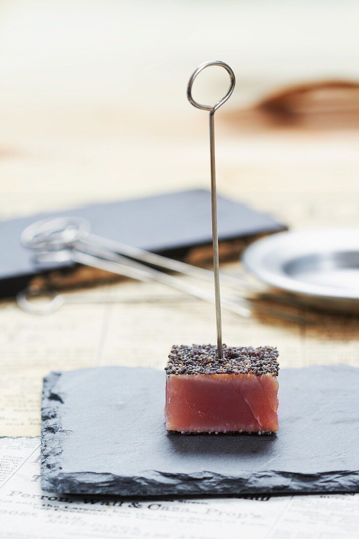 A tuna fish cube with poppyseeds (Japan)