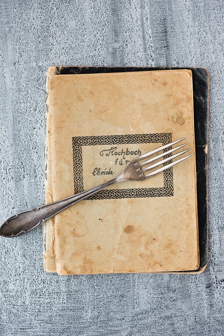 A fork on an old recipe book