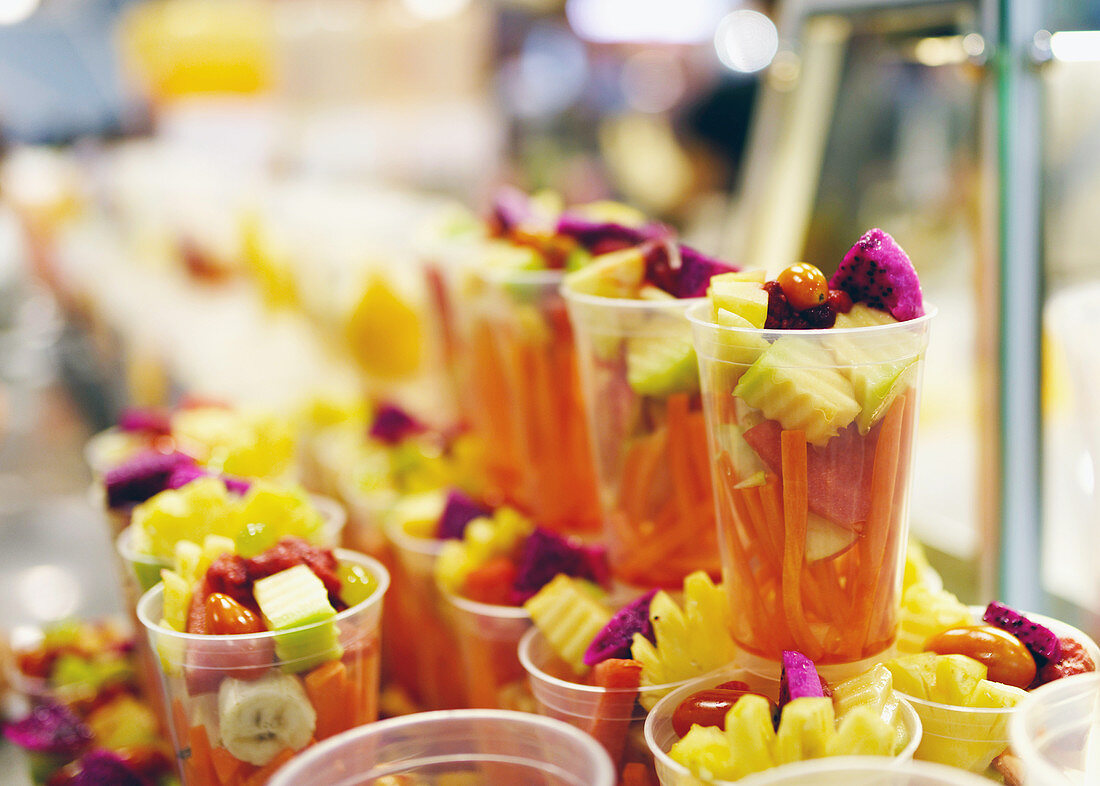 Fruit and vegetable cocktails in plastic cups