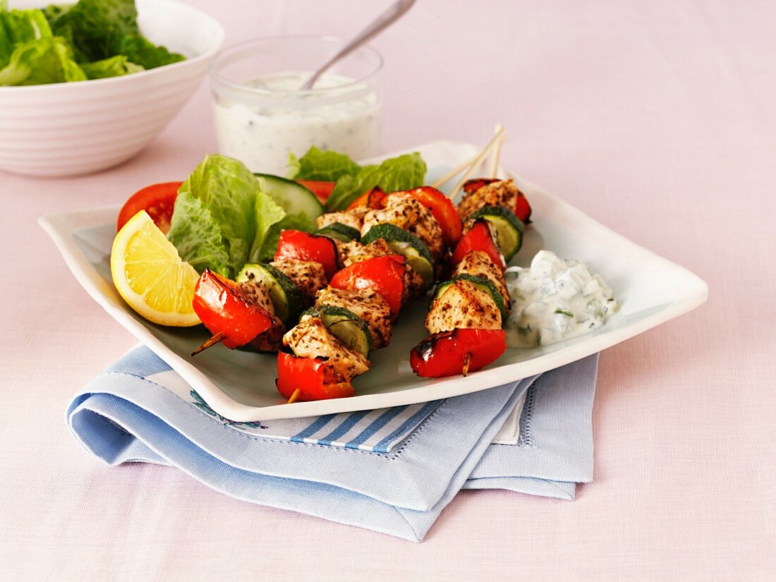 Greek chicken, pepper and courgette kebabs with salad