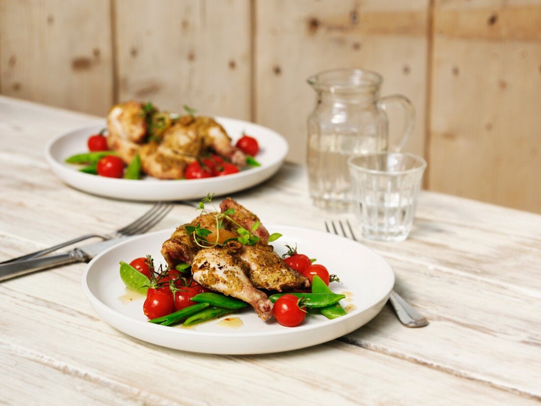 Half a herb chicken with tomatoes and mange tout