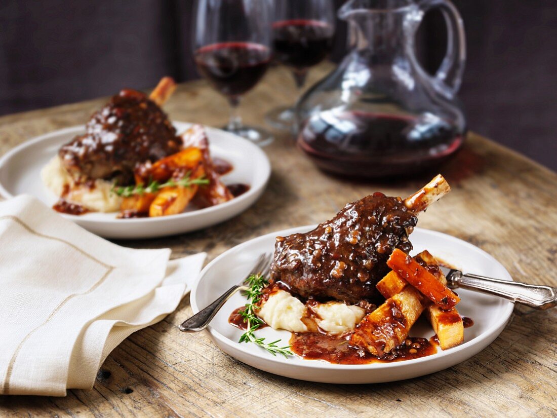 Lamb shanks with mashed potatoes, parsnips, gravy and wine